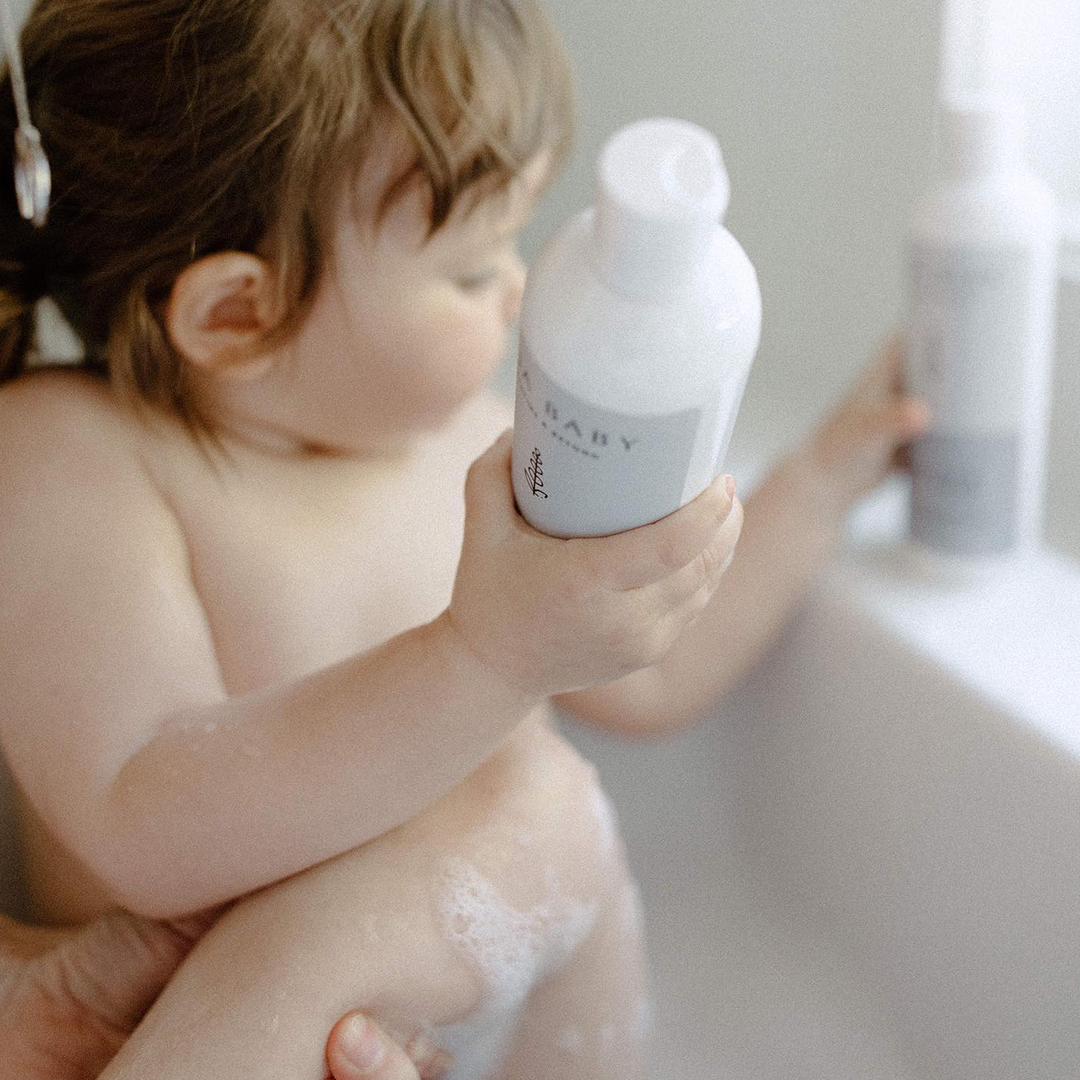 Baby Lavender Conditioner Baby Holding Bottle Bath Time